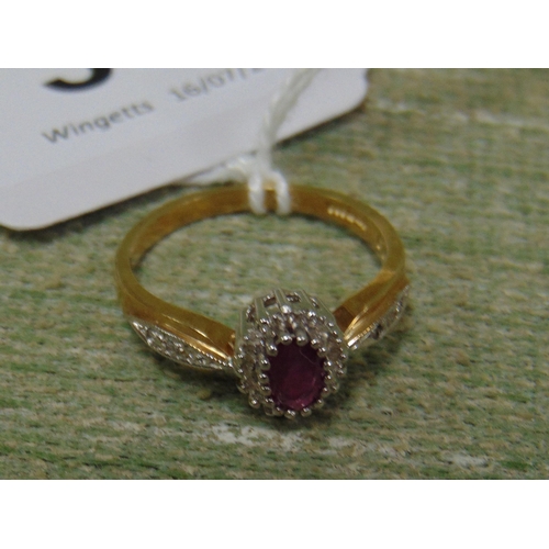 38 - 9ct gold ring, set with ruby stone surrounded by diamond chips, size Q.