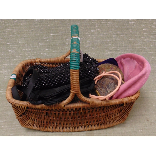 460 - Collection of vintage handbags and hats, contained in a wicker basket.