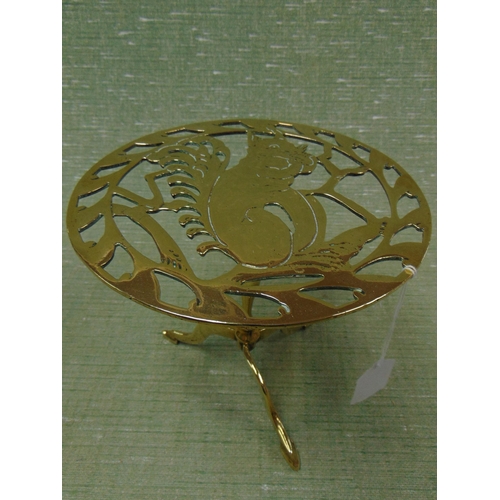 5 - 19th century brass trivet, the centre decorated with a squirrel. 7