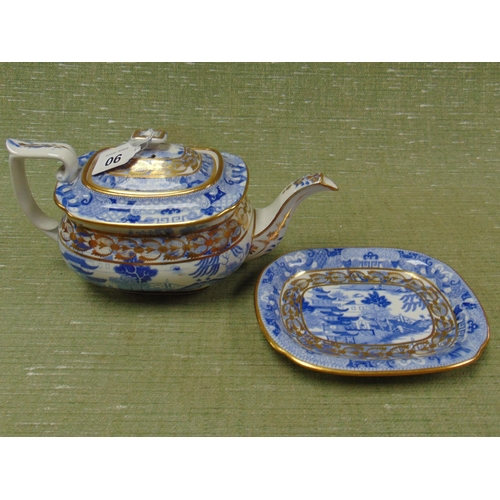 90 - Antique willow pattern teapot on stand,  having gilt highlights.