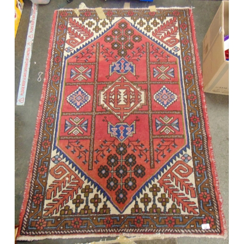 69 - Red and blue ground rug, having geometric pattern, 57 x 40