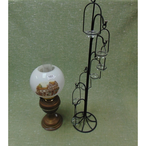 101 - Brass oil lamp and a candle holder.