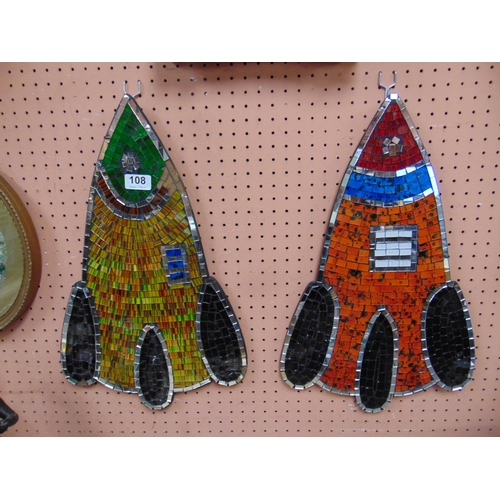 108 - Pair of coloured mirrored rocket form plaques, each 20 x 11