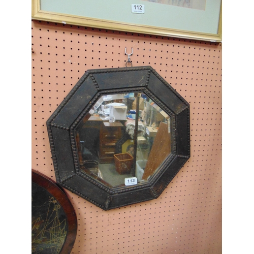 113 - An oak octagonal framed wall mirror, 16