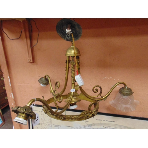71 - Ornate gilt metal light fitting.