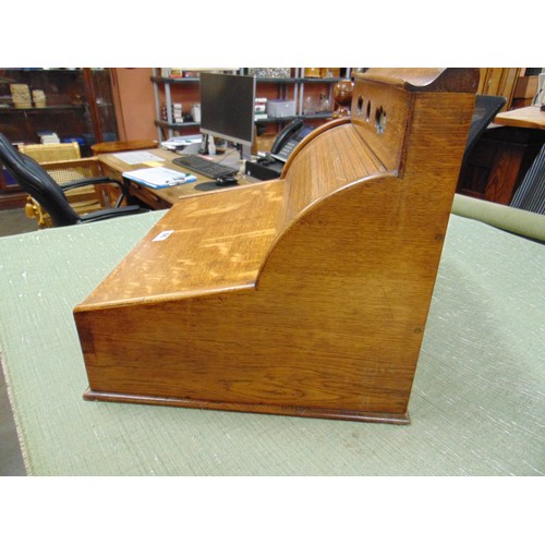 66 - Antique oak writing slope, the top having perpetual calendar, tambour front with pull out leather su... 