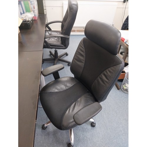 59 - Two swivel office chairs and an office desk.