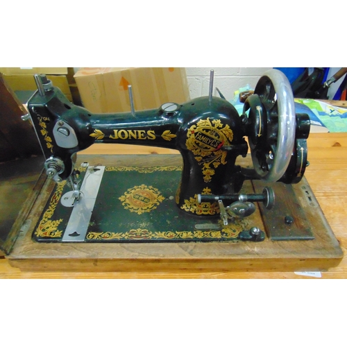 13 - An oak cased Jones sewing machine.