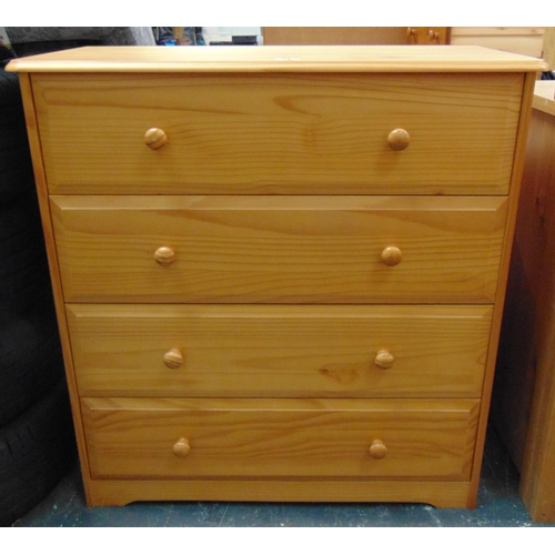 25 - Modern pine chest of four long drawers  with knob handles. 35 x 33 x 15