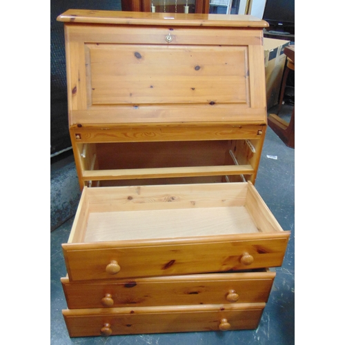 47 - Modern pine bureau, fall front revealing a fitted interior, three long drawers with knob handles, 40... 