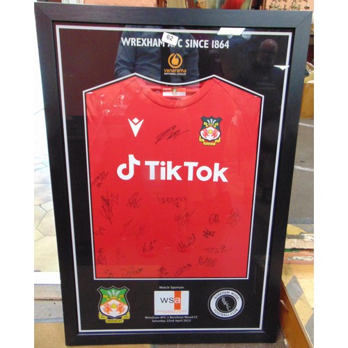 62 - Framed and glazed, Wrexham AFC shirt - signed by the team, following the 3-1 victory over Boreham Wo... 