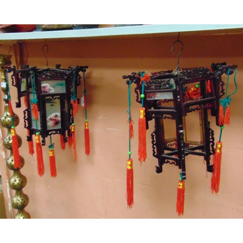 50 - Pair of reproduction Oriental hanging lanterns, having painted glass panels.