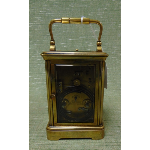 176 - Magray & Chisholm Paris  brass cased carriage clock, having enamel face and Roman numerals, 5