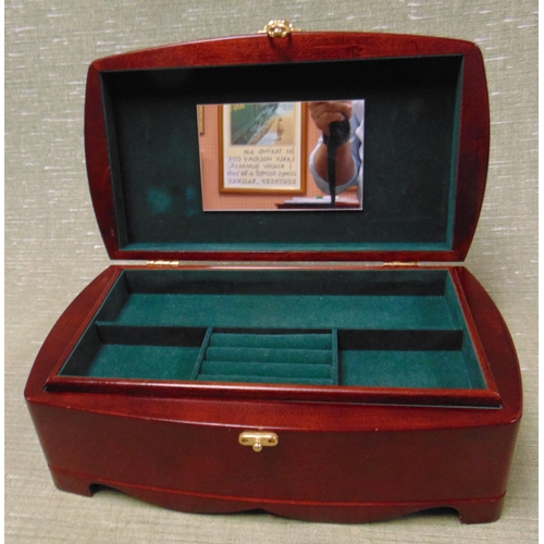 296 - Modern jewellery box, having lift up lid and fitted interior.