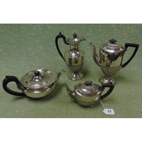 32 - Plated three piece tea service, having ebony finials and gadrooned decoration.