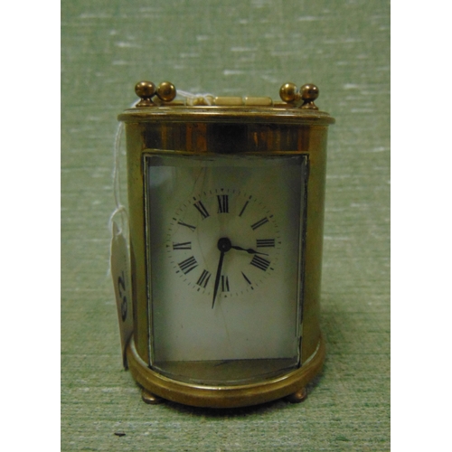 62 - Antique silver cylindrical form brass cased miniature carriage clock, having enamel face and Roman n... 