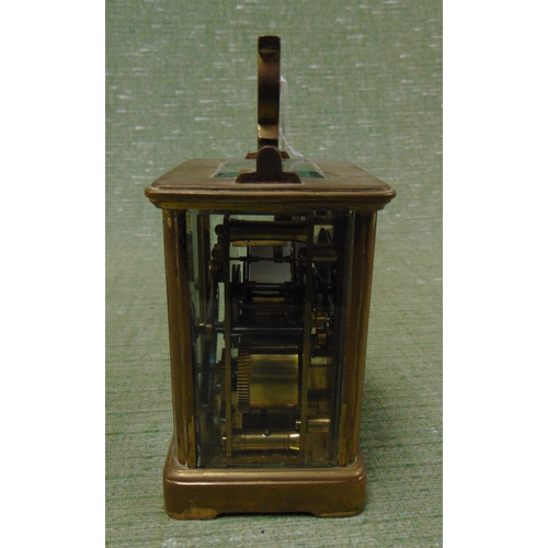 66 - Brass carriage clock, having enamel face and Roman numerals, 4.5