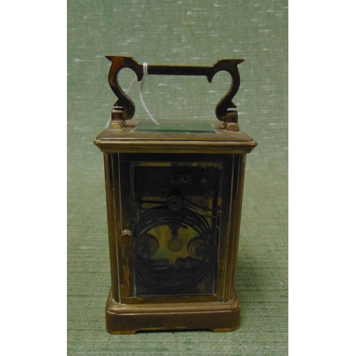 66 - Brass carriage clock, having enamel face and Roman numerals, 4.5