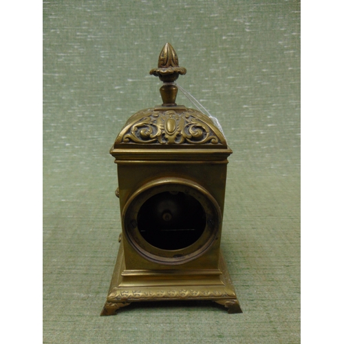 78 - Ornate brass mantle clock, enamel numerals, lion mask side handles, and on bracket feet, 8 x 4 x 4