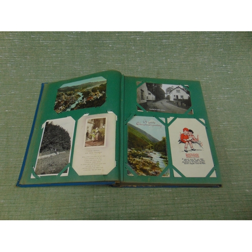 31 - Postcard album and contents.