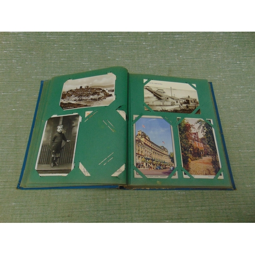 31 - Postcard album and contents.