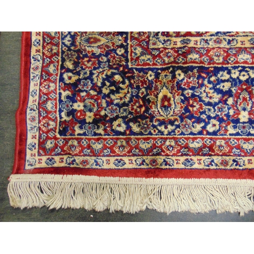 45 - Red ground floral rug, 86 x 62