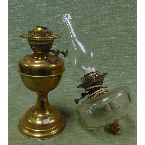 116 - Antique clear glass oil lamp and a brass example.