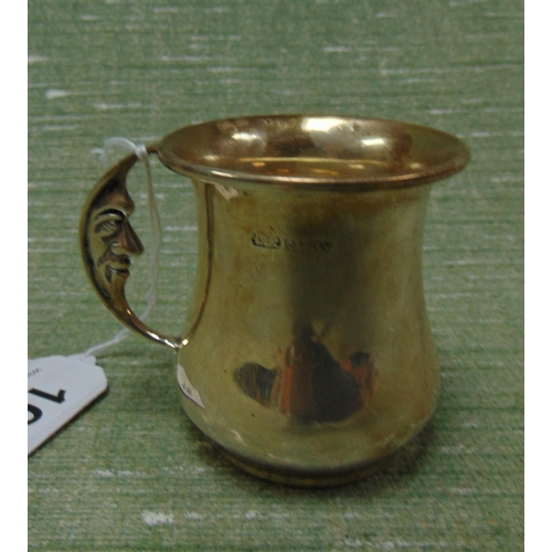 16 - Silver christening mug, having moon face form handle, Birmingham 1962.