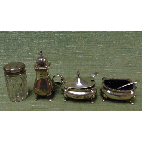 164 - Silver three piece cruet, Birmingham and a silver mounted dressing table jar.