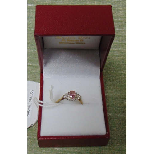 177 - 9k marked ring, set with pink and clear glass stones, size M/N.