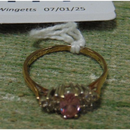 177 - 9k marked ring, set with pink and clear glass stones, size M/N.