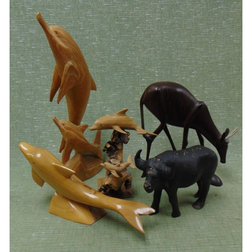 249 - Various wooden dolphin figures.