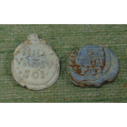 328 - Two antique lead flower seals, one dated 1737.