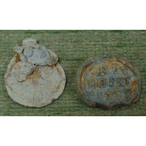 328 - Two antique lead flower seals, one dated 1737.