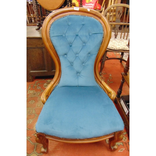 331 - Victorian Ladies chair, button back, on frontal cabriole supports and castors.