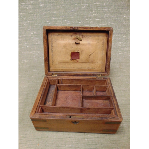 36 - Walnut brass bound writing box, having lift up lid and fitted interior, 4 x 9 x 6