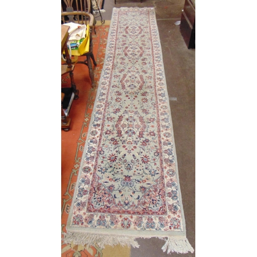 360 - Green and red ground runner, having geometric floral pattern decoration, 150 x 30