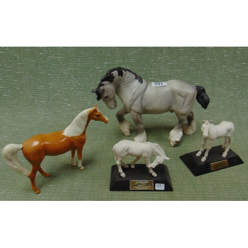 391 - Beswick matt shire horse figure and three smaller examples.