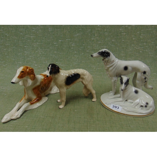 393 - Three ceramic dog figures.