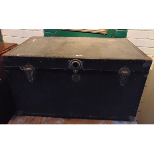 455 - Metal studded travel trunk, having lift up lid and side handles.