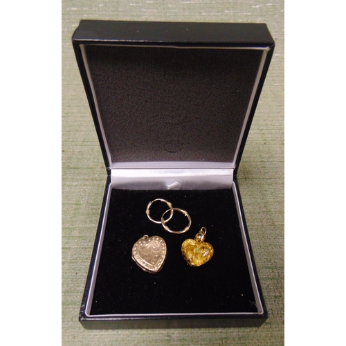 68 - 9ct marked heart shaped locket, pair of possibly gold earrings, and a heart shaped pendant.