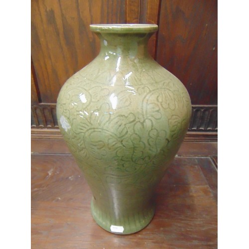 101 - Celadon vase, having foliate decoration, 14.5