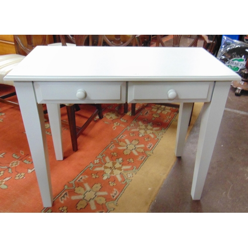 323 - Painted two drawer side table, set on tapered supports, 30 x 36 x 17