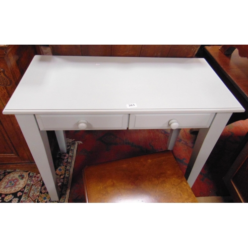 323 - Painted two drawer side table, set on tapered supports, 30 x 36 x 17