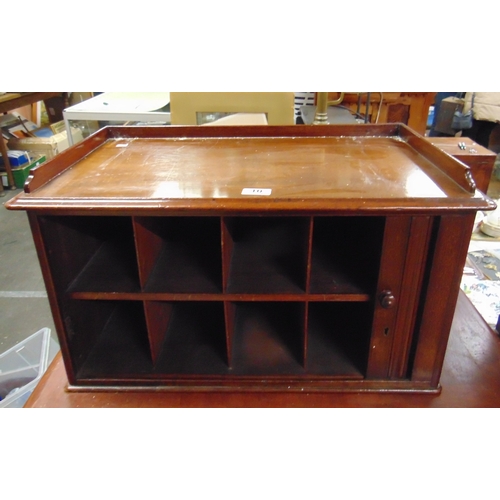 10 - Victorian mahogany table top cabinet, the raised back over tambour front, revealing a shelf lined in... 