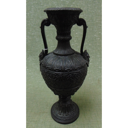 11 - Two handled pottery vase, having embossed decoration, 15