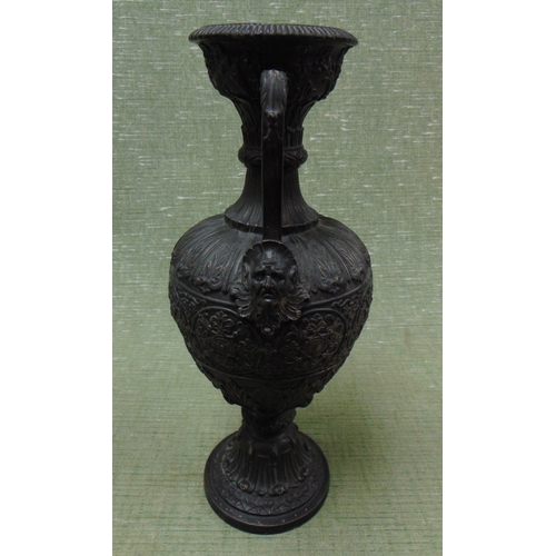 11 - Two handled pottery vase, having embossed decoration, 15