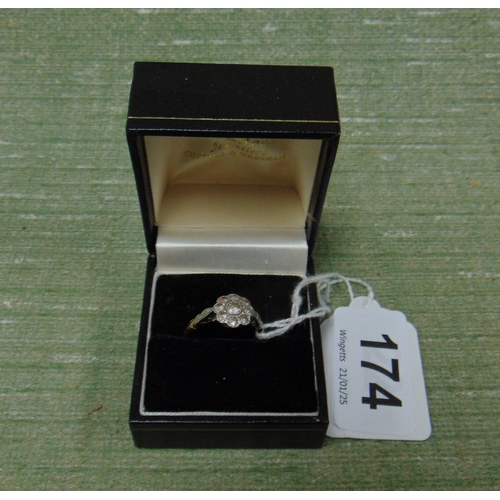 174 - 18ct plat ring, set with floral form stones, size O.