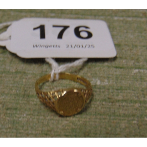 176 - Possibly gold signet ring, set with a faux 1/4 sovereign, size L.