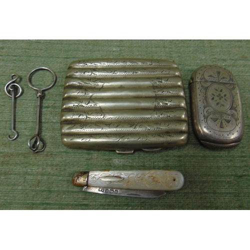 204 - Silver bladed fruit knife, silver brooch, frame, plated vesta case and a plated cigarette case.